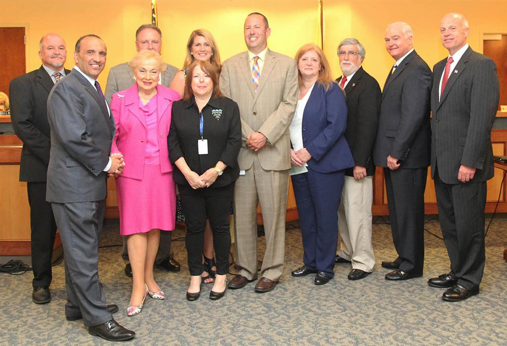 Freeholders and Monmouth County Clean Communities staff present Borough of Matawan with a $10,000 Recycling Stimulus Initiative Grant. Front row left to right: Freeholder Thomas A. Arnone, Freeholder Lillian G. Burry and Fran Metzger. Back row left to right: Richard Throckmorton, William Johnson (obstructed), Freeholder Deputy Director Serena DiMaso, Stuart Newman, Matawan Recycling Coordinator Grace Rainforth, Matawan Mayor Paul Buccellato, Freeholder John P. Curley and Freeholder Director Gary J. Rich, Sr.